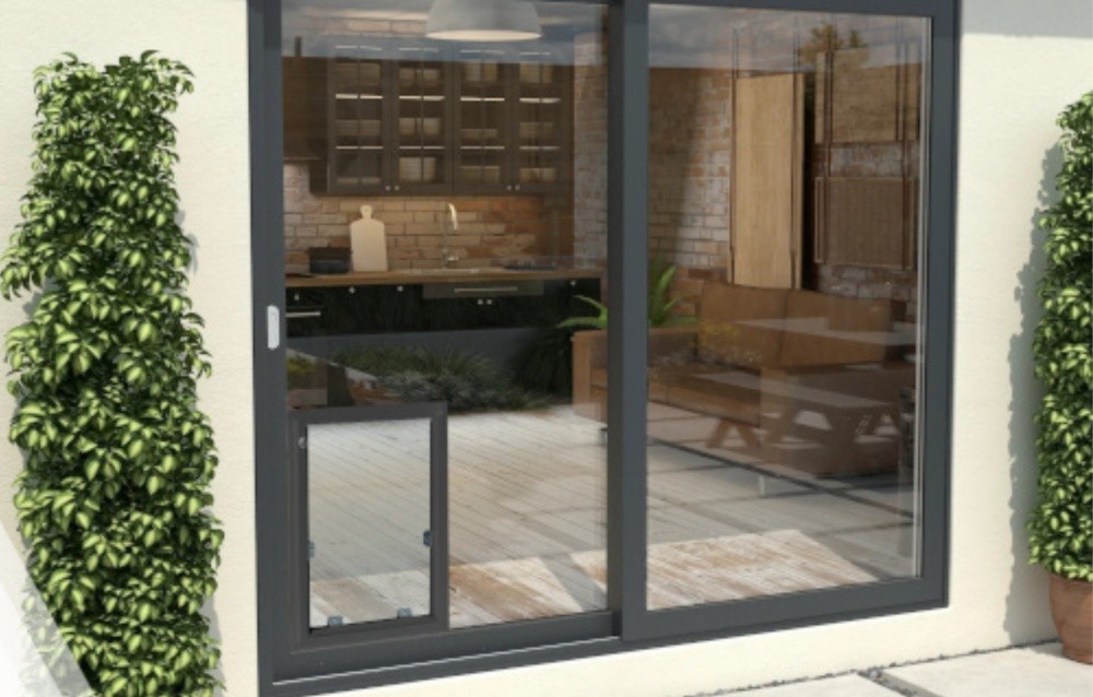 Sliding glass door with an in-glass pet door installed in the lower panel