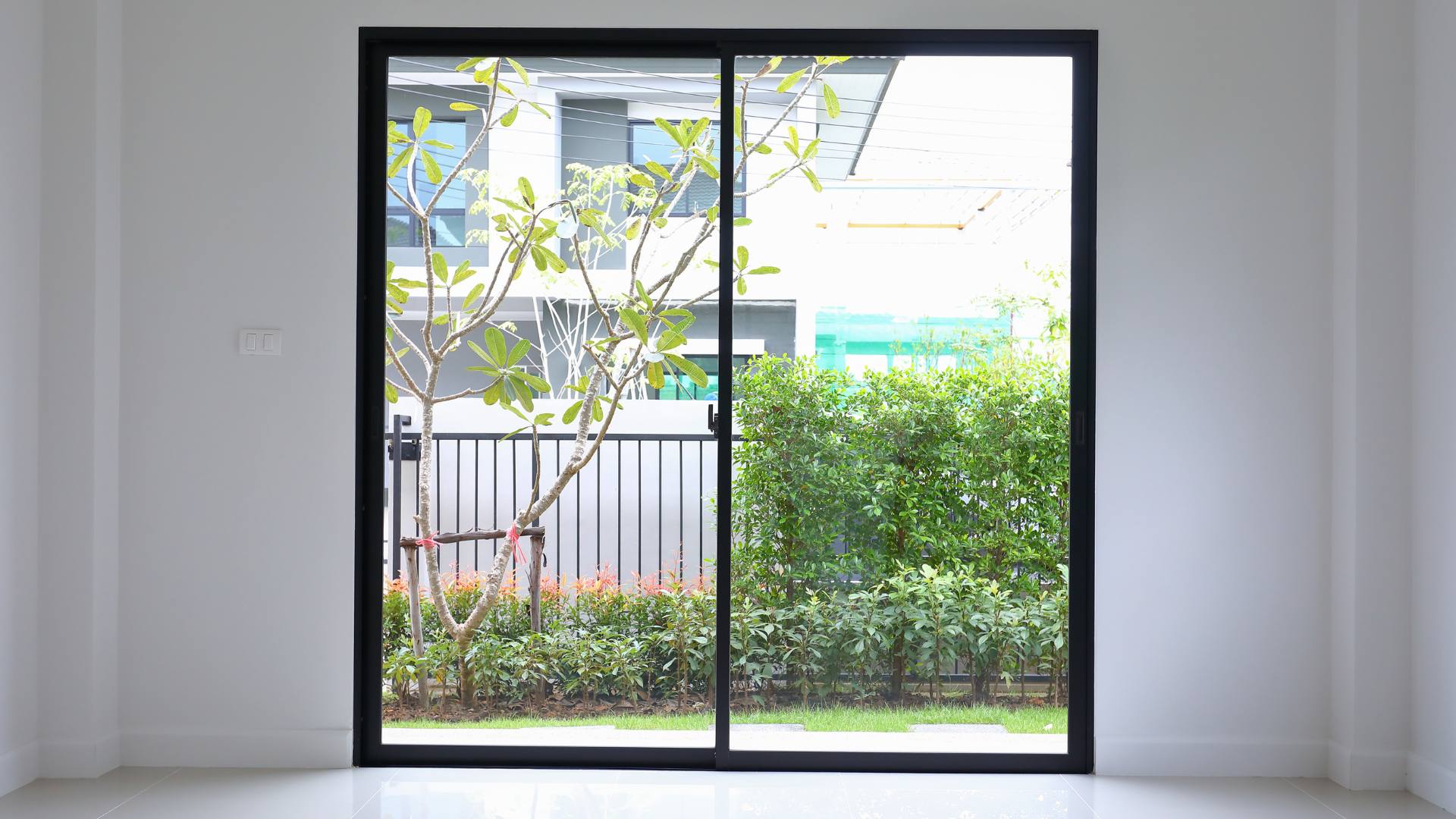 Sliding glass doors opening onto a garden